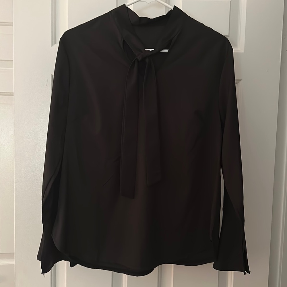 Black shiny long sleeved top with neck tie